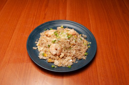 Photo for Authentic and traditional Chinese dish known as shrimp fried rice - Royalty Free Image