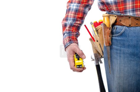 Caucasian contractor hold measure tape in his hand on white background. Home renovation construction concept. Space for text