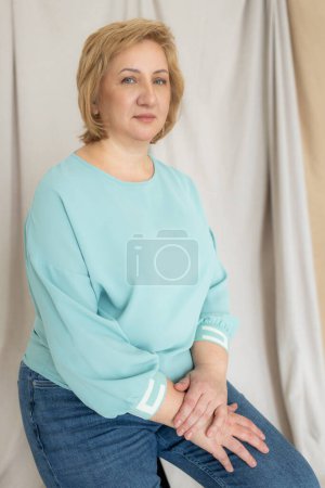 Photo for Happy mature blonde lady. Web cam view laughing middle aged woman having fun, talking with grown up children online. - Royalty Free Image