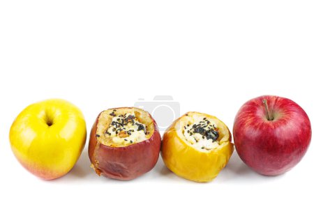 Photo for Yellow and red fresh and stuffed baked apples with sezame seeds and walnuts isolated on a white background - Royalty Free Image