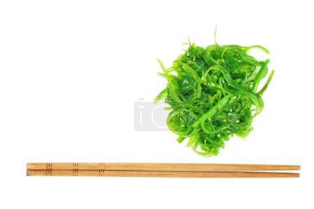 Photo for Wakame seaweed and chopsticks isolated on white background - Royalty Free Image