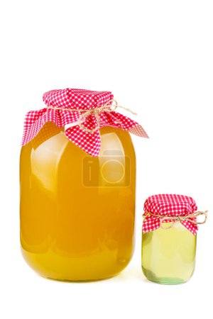 Photo for Big and small jars with honey isolated on white background - Royalty Free Image