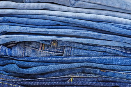 Photo for Stack of different blue jeans.Background - Royalty Free Image