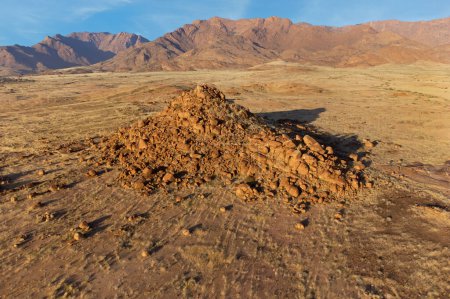 Scenic desert landscape with rocks and arid grassland, Brandberg mountain, Namibia