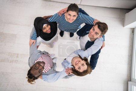 Top view of a diverse group of people symbolizes togetherness. High quality photo