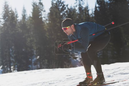 Photo for Nordic skiing or Cross-country skiing classic technique practiced by man in a beautiful panoramic trail at morning. High quality photo - Royalty Free Image