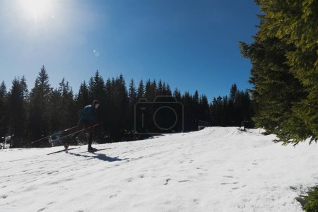 Photo for Nordic skiing or Cross-country skiing classic technique practiced by man in a beautiful panoramic trail at morning. High quality photo - Royalty Free Image
