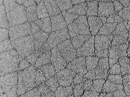Foto de Camino de asfalto agrietado. Patrón de textura de la acera agrietada fondo. Foto de alta calidad - Imagen libre de derechos