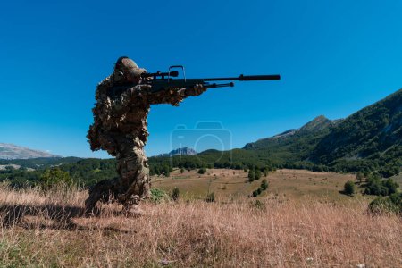 Photo for Army soldier holding a sniper rifle with scope and walking in the forest. war, army, technology and people concept - Royalty Free Image