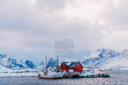 Photo for Traditional Norwegian fishermans cabins and boats. - Royalty Free Image