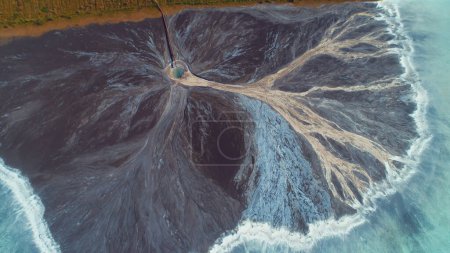 Téléchargez les photos : Top down aerial view over natural texture - abstract industrial lake water patterns. Turquoise waternature poluttion. Hi quality 4K footage. - en image libre de droit