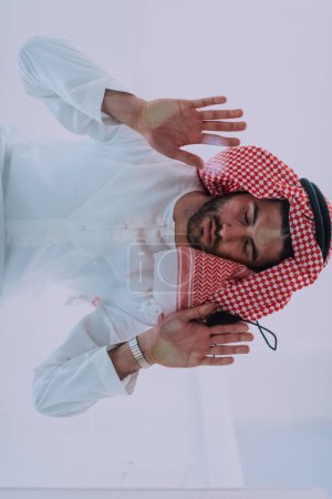 Photo for Muslim man doing sujud or sajdah on the glass floor. - Royalty Free Image