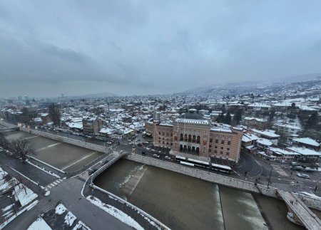 Photo for Sarajevo city hall or national library in town center aerialhyper lapse or time lapse. Landmark in capital of Bosnia and Herzegovina covered with fresh snow in the winter season at night. Hi quality - Royalty Free Image