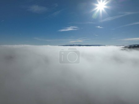 Photo for Aerial View. Flying over the high mountains in beautiful clouds. Aerial Drone camera shot. Air pollution clouds over Sarajevo in Bosnia and Herzegovina. Hi quality 4K footage. - Royalty Free Image