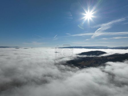 Téléchargez les photos : Aerial View. Flying over the high mountains in beautiful clouds. Aerial Drone camera shot. Air pollution clouds over Sarajevo in Bosnia and Herzegovina. Hi quality 4K footage. - en image libre de droit