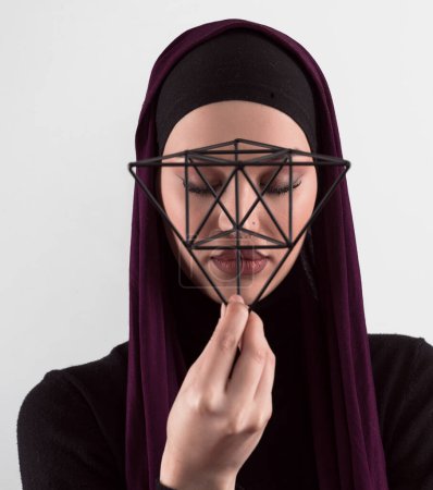 Photo for Muslim woman wearing modern stylish wear and hijab isolated on grey background. Diverse people model hijab fashion concept. Face recognition and biometric data identify face science. High quality - Royalty Free Image