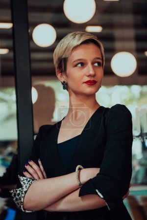 Photo for Business woman in a black suit, successful confidence with arms crossed in modern office. - Royalty Free Image