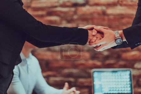 Foto de Business shaking hands, finishing up meeting. Successful businesspeople handshaking after good deal. - Imagen libre de derechos