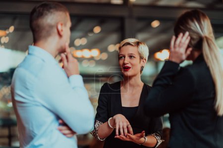 Photo for Photo of a business team of young people discussing business ideas in a modern urban environment. Selective focus. - Royalty Free Image