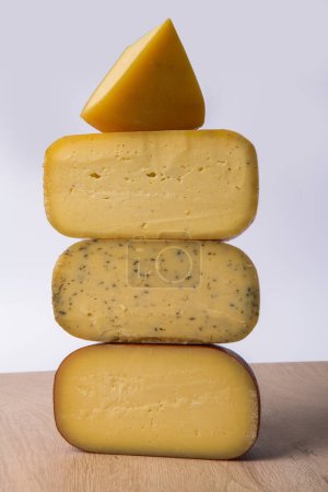 Téléchargez les photos : A piece of fresh processed cheese isolated on a white background. - en image libre de droit