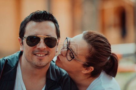 Photo for A romantic couple spends time in the park. A couple takes pictures on a beautiful sunny day while having a weekend off. - Royalty Free Image