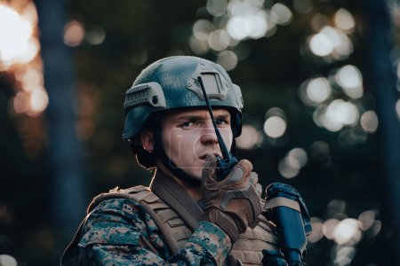 Photo for Modern Warfare Soldier Commander Officer Talking Portable Radio Station and Give Orders Subdivision Squad. - Royalty Free Image