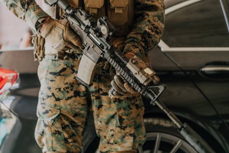 Téléchargez les photos : American marine corps special operations soldier preparing tactical and communication gear for action battle closeup. - en image libre de droit