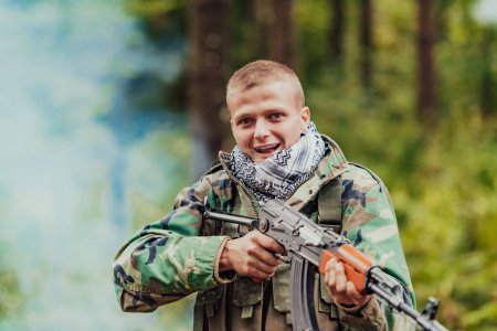 Photo for Angry terrorist militant guerrilla soldier warrior in forest. - Royalty Free Image