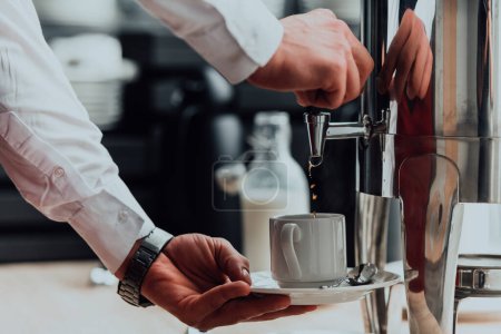 Photo for The waiter preparing coffee for hotel guests. Close up photo of service in modern hotels. - Royalty Free Image
