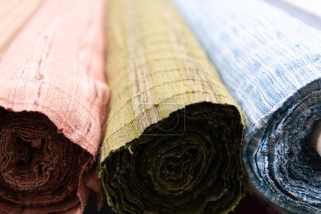 Photo for Collection of fashionable fabrics. Samples of different natural fabrics for sewing a fashion collection of clothes. Large selection of fabrics in the store or tailor warehouse. High quality photo - Royalty Free Image