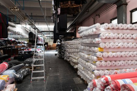 Photo for Interior of an industrial warehouse with fabric rolls samples. Small business textile colorful warehouse. High quality photo - Royalty Free Image