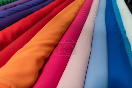 Photo for Collection of fashionable fabrics. Samples of different natural fabrics for sewing a fashion collection of clothes. Large selection of fabrics in the store or tailor warehouse. High quality photo - Royalty Free Image