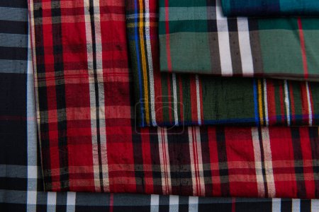 Photo for Collection of Scottish fashionable fabrics . Samples of different natural fabrics for sewing a fashion collection of clothes. Large selection of fabrics in the store or tailor warehouse. High quality - Royalty Free Image