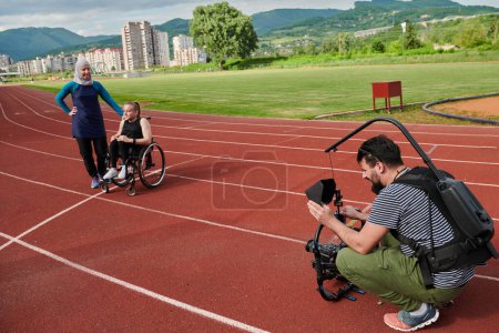 Photo for A cameraman filming the participants of the Paralympic race on the marathon course. High quality photo - Royalty Free Image