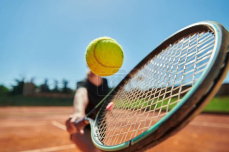 Photo for Close up photo of a young girl showing professional tennis skills in a competitive match on a sunny day, surrounded by the modern aesthetics of a tennis court - Royalty Free Image