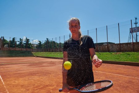 Photo for Before her training, the tennis player joyfully playing with a tennis ball, radiating enthusiasm and playfulness, as she prepares herself mentally and physically for the upcoming challenges on the - Royalty Free Image