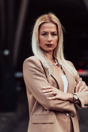 Photo for A powerful portrait of a businesswoman, standing confidently with her arms crossed, representing the determination of the female gender and embodying strength and success. - Royalty Free Image