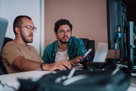 Photo for Programmers engrossed in deep collaboration, diligently working together to solve complex problems and develop innovative mobile applications with seamless functionality - Royalty Free Image