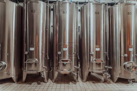 Photo for Modern wine distillery and brewery with brew kettles pipes and stainless steel tanks. - Royalty Free Image