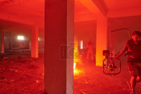 Photo for A professional cameraman captures the intense moments as a group of skilled soldiers embarks on a dangerous mission inside an abandoned building, their actions filled with suspense and bravery. - Royalty Free Image
