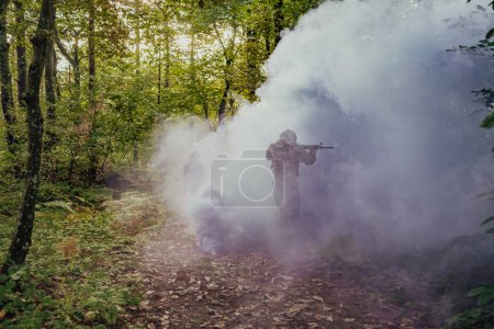 Photo for Battle of the military in the war. Military troops in the smoke. - Royalty Free Image