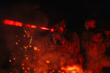 Photo for Soldiers squad in action on night mission using laser sight beam lights military team concept. - Royalty Free Image