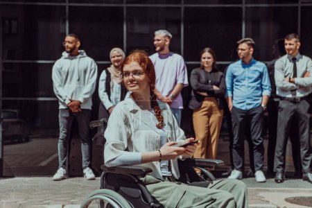 Photo for A diverse and confident group of young businessmen poses together, with businesswoman in wheelchair radiating success, ambition, and unity, capturing the essence of a dynamic and inspiring business - Royalty Free Image