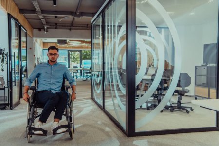 Photo for In a large modern corporation, a determined businessman in a wheelchair navigates through a hallway, embodying empowerment and inclusivity in the corporate world - Royalty Free Image