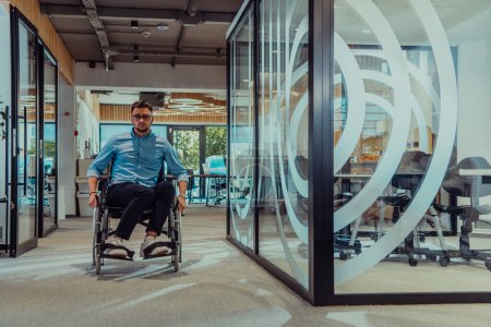 Photo for In a large modern corporation, a determined businessman in a wheelchair navigates through a hallway, embodying empowerment and inclusivity in the corporate world - Royalty Free Image
