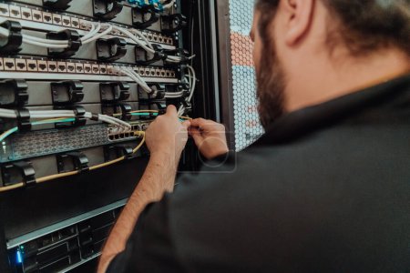 Photo for Close up of technician setting up network in server room . - Royalty Free Image