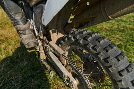 Photo for Close up photo of a professional motocross rider in action, showcasing the tire and various components of the motorcycle as they navigate the challenging off-road terrain with speed and precision - Royalty Free Image