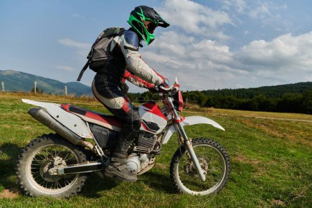 Photo for A professional motocross rider exhilaratingly riding a treacherous off-road forest trail on their motorcycle - Royalty Free Image