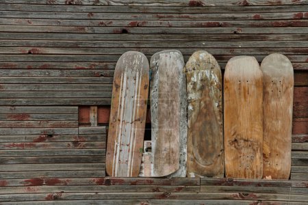 Photo for In a creative display of repurposing, old ski and snowboard decks have been transformed into unique wall decorations, adding a rustic and nostalgic charm to the interior of the house. - Royalty Free Image