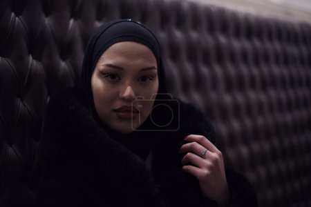 Photo for Arabic women with abaya bonding and having fun outdoors - Happy Middle Eastern female having a break take a cup of tea in restaurant - Royalty Free Image